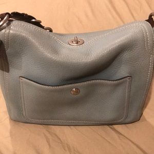Coach light blue shoulder bag signs of wear.